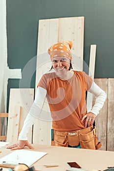 Self employed female carpenter smiling portrait
