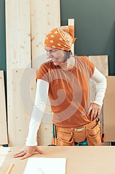 Self employed female carpenter smiling portrait