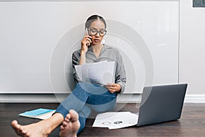 Self-employed woman looking on documents