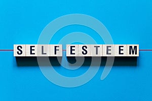 Self-esteem word concept on cubes