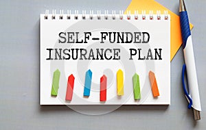 Self Funded Insurance text quote on card, concept background photo