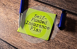 Self Funded Insurance text quote on card, concept background. photo