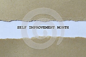 self improvement month on white paper