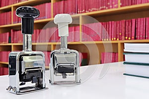 Self-inking, rubber date stamp on the table in the library.