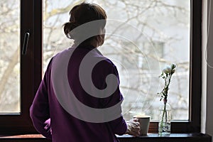 A Self-isolate Woman or Quarantine Looking Out