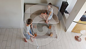 Self-isolation family life. Top view mother with son on self-isolation. Son Training Golf. Swing Barefoot with the Golf