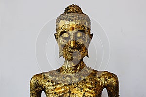 Self-mortification Buddha statue with gold leaf attached to the body