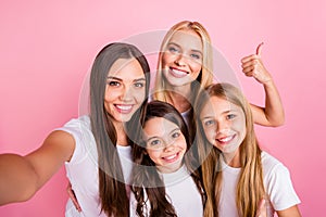Self-portrait of four nice attractive lovely charming cute cheerful cheery long hair girls showing thumbup ad advert