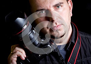 Self portrait of the photographer with DSLR camera