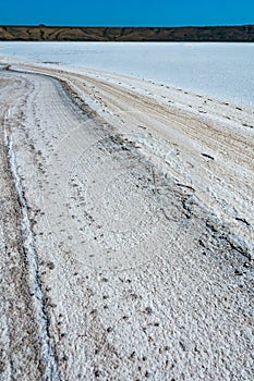 Self-precipitating table salt sodium chloride on the surface of a dried-up reservoir