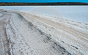 Self-precipitating table salt sodium chloride on the surface of a dried-up reservoir