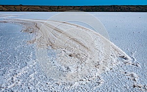 Self-precipitating table salt sodium chloride on the surface of a dried-up reservoir