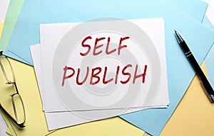 SELF PUBLISH text on paper on the colorful paper background