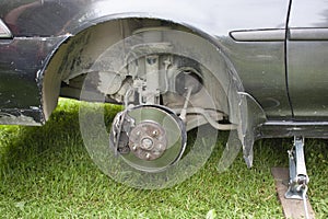 Self-repair of the car brake system. The machine is jacked up with a wheel removed