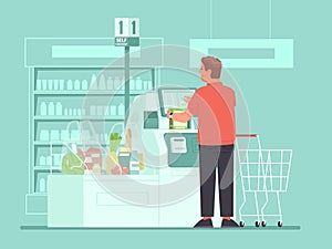 Self-service cashier in the supermarket. A man customer rings up groceries at a self-checkout terminals at a grocery store