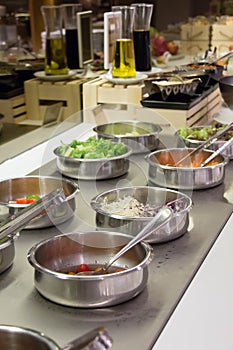 Self service salad bar with a variety of salads