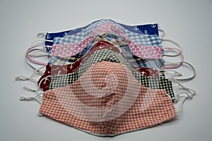 Self-sewn cloth masks to prevent the corona virus on a light background