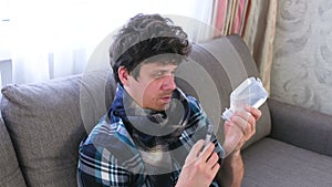 Self-treatment. Sick man gains the saline and medicament into the syringe.