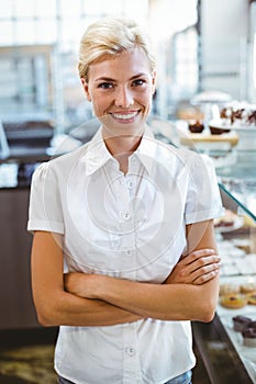 Selfassured female waitress smiling photo