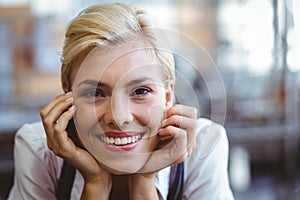 Selfassured female waitress smiling photo