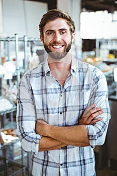Selfassured waiter smiling