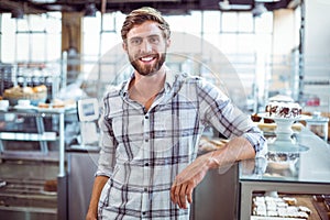 Selfassured waiter smiling