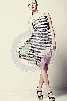 Selfhood. Funky Woman wearing Stylish light Fluttering Dress