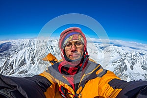 Selfi male climber in the snowy mountains
