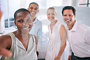 Selfie, diversity and happy business people looking happy together in a startup office. Casual workplace and employees