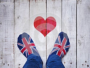 Selfie feet wearing socks with British flag pattern