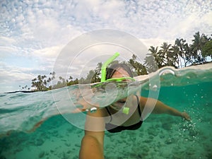 Selfie of a female woman tourist snorkelling at a beach at Matautu, Lefaga, Upolu Island, Samoa, South Pacific photo