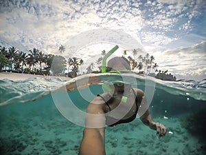 Selfie of a female woman tourist snorkelling at tropical beach a photo