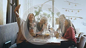 Selfie Four women sitting in a cafe