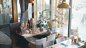 Selfie four women sitting in a cafe