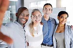 Selfie, friends and team with a business man and woman group taking a photograph together in their office. Portrait