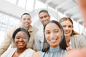 Selfie with fun friends in the office, working together as a team of business people and professional colleagues