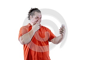 Selfie. Funny fat man. White background. Isolated