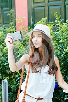 Selfie girl pouting with bike