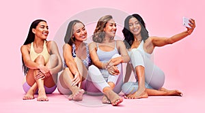 Selfie, group or women with fitness, relax or social media with health on a pink studio background. Post, girls or