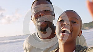 Selfie, love and black influencer couple on beach vacation or holiday while vlogging and streaming travel journey
