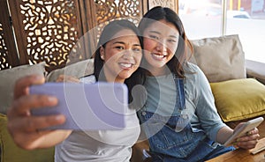 Selfie, love and a lesbian couple in a restaurant for a romantic date together on their anniversary. LGBT, smile and