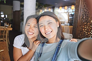 Selfie, love and an LGBT couple in a restaurant for a romantic date together on their anniversary. Portrait, smile and a