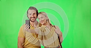Selfie, phone and couple in studio with green screen for romance, love and happiness. Smile, happy and young man and