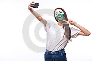 Selfie on phone of Welsh football fans in game supporting of Wales national teams