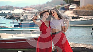 Selfie photo at beach, Asian women taking selfie during travel holiday in luxury greece vacation. Girl tourists vlogging