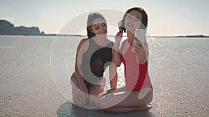 Selfie photo on beach, Asian women taking video recording on travel holiday in luxury greece vacation. Girl tourists