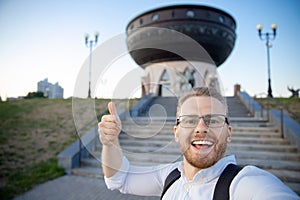 Selfie photo happy tourist man background family center Kazan main wedding palace republic of Tatarstan. Concept Travel