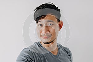 Selfie photo of man in blue t-shirt isolated on white background.