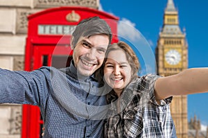 Selfie photo of young happy couple travelling in London