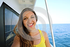 Selfie photo of young model woman on luxury travel cruise vacation in yellow dress enjoying the evening on Amalfi Coast getaway h